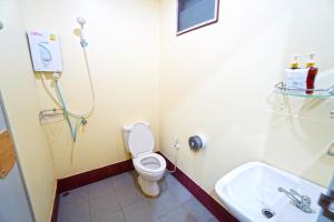 a bathroom with a toilet and a sink at Star Hill River Kwai Resort in Ban Kaeng Raboet
