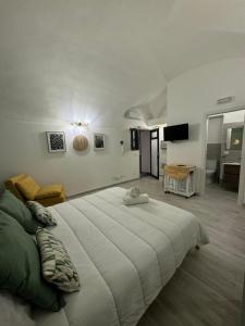 a bedroom with a large bed in a room at Corte Capuana in Catania