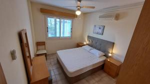 Posteľ alebo postele v izbe v ubytovaní Yialos cozy beach house