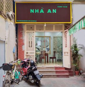 two motorcycles parked in front of a store at Nhà An Hostel in Hanoi