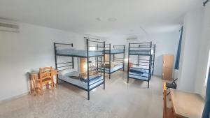 Postel nebo postele na pokoji v ubytování ALBERGUE LA TIÑOSA