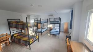 Postel nebo postele na pokoji v ubytování ALBERGUE LA TIÑOSA