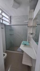 a bathroom with a shower and a sink and a toilet at Apê in Copacabana in Rio de Janeiro