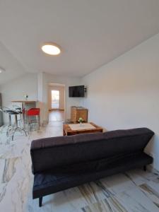 a living room with a couch and a table at Haus Grimming in Öblarn