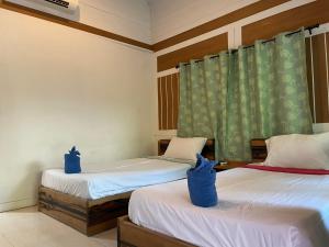 Katil atau katil-katil dalam bilik di Phi Phi Twin Palms Bungalow