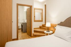 Postel nebo postele na pokoji v ubytování Chalet Falorie