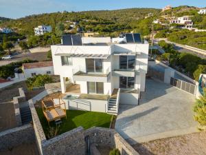an aerial view of a white house at XENIA LUXURY APARTMENTS CHIOS in Chios