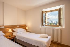 Postel nebo postele na pokoji v ubytování Chalet Falorie