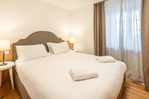 Postel nebo postele na pokoji v ubytování Chalet Falorie