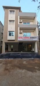 a building with a hotel waikikiagency sign on it at HOTEL VAISHNO AEROCITY in Bhubaneshwar