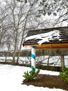 a building with snow on top of it at La Villa del Barone in Predaia +31 photos