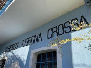 a sign on the side of a building at “Corona Grossa” - due posti letto - A in Brusasco
