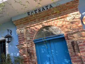 a blue door on the side of a brick building at “Corona Grossa” - due posti letto - A in Brusasco