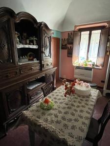 a dining room with a table with a cake on it at “Corona Grossa” - due posti letto - A in Brusasco