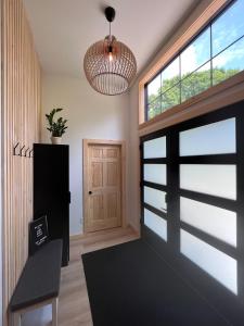a room with a door and a potted plant at Kings Woods Lodge - Nature Resort & Venue in Wine Country in Kingsville