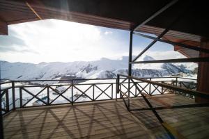 a room with a view of a mountain at Chalet Papa Basili in Gudauri