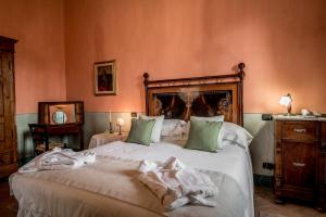 Postel nebo postele na pokoji v ubytování Agriturismo Podere La Rocca
