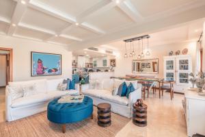 a living room with a couch and a table at SPECIAL PRICE Puerto Bahia 3BR Villa in Santa Bárbara de Samaná