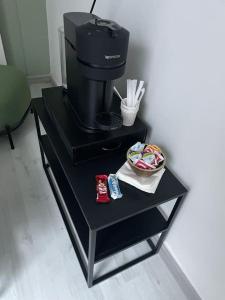 a coffee table with a coffee maker on it at Attico “the Queen” in Caravaggio