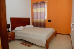 Кровать или кровати в номере Apartamentos Santiago - Praia