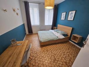 Postel nebo postele na pokoji v ubytování L'olivier