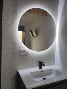 a bathroom with a sink and a mirror at Supl. 22 Cabernet in Novelda