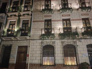 a building with a bunch of windows and balconies at Supl. 22 Cabernet in Novelda