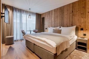 Una cama o camas en una habitación de Postresidenz am See