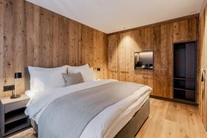 Una cama o camas en una habitación de Postresidenz am See