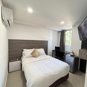 Postel nebo postele na pokoji v ubytování Hotel Sun Suite