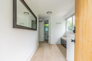 a bathroom with a mirror and a sink at Capitol Hill Cutie in Seattle