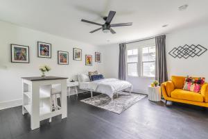a living room with a bed and a couch and a table at Capitol Hill Cutie in Seattle +16 photos