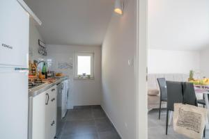 Kuchyň nebo kuchyňský kout v ubytování Apartments Sonata