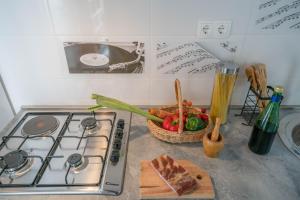 Kuchyň nebo kuchyňský kout v ubytování Apartments Sonata