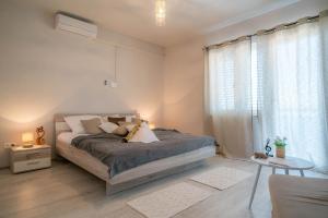 Postel nebo postele na pokoji v ubytování Apartments Sonata