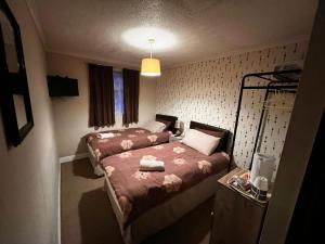Cama o camas de una habitación en Lynton Hotel