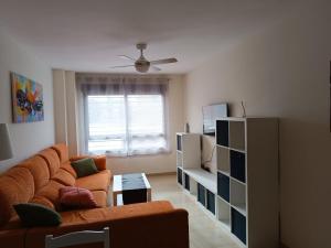 a living room with a couch and a table at Apartamento Murcia in Murcia