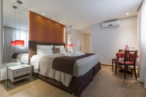 Postel nebo postele na pokoji v ubytování Tarobá Hotel
