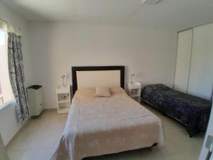 En eller flere senge i et værelse på Alojamiento Mi casita