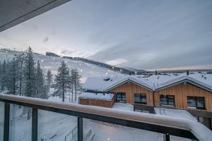a view of a house in the snow at Slopeside Bliss C21 Levi Center by Aavalevi in Levi