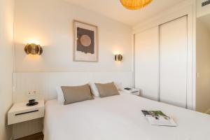 Posteľ alebo postele v izbe v ubytovaní Port Forum Apartments by Olala Homes