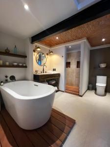 a large bathroom with a large tub and a sink at Casa 63 Hotel Boutique & Spa - Adults Only in San Miguel de Allende
