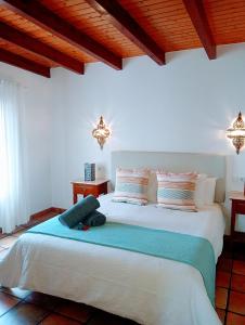 a bedroom with a large bed in a room at Casa Strelitzia in Nazaret