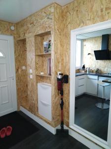 a small kitchen with a camera in the corner at Studio, La terrasse d'Isa in Dole