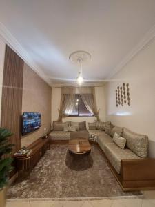 Гостиная зона в Charite Host Appartement , Wifi et Parking Gratuit