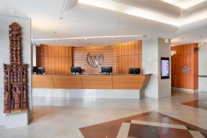 a lobby with a reception desk in a building at Windsor Excelsior Copacabana in Rio de Janeiro