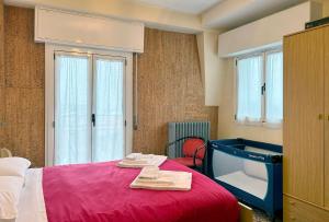 Ένα ή περισσότερα κρεβάτια σε δωμάτιο στο Garden - residence in the center of Barzio
