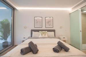 a bedroom with a large bed and a large window at Sea View Apartment Near The Beach in Fuengirola +33 photos