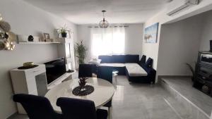 Posedenie v ubytovaní Apartments Mikas