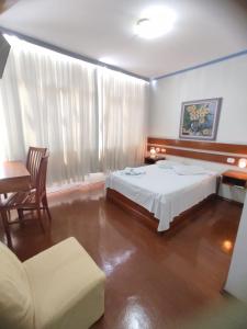 Postel nebo postele na pokoji v ubytování HOTEL MARAMBAIA
